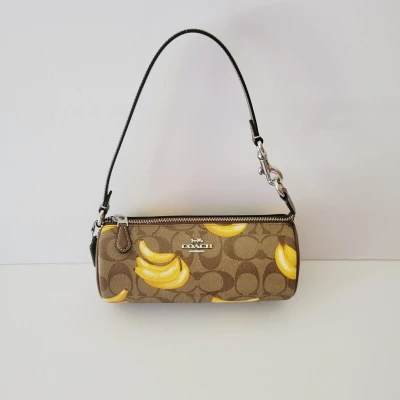 Coach Nolita Barrel Bag In Signature Canvas With Banana Print